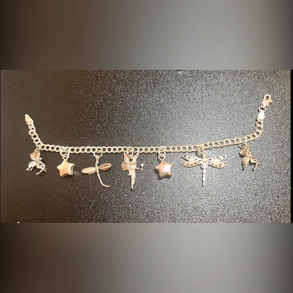 Charm bracelet with fairies. Sterling silver 8” with 7 charms
